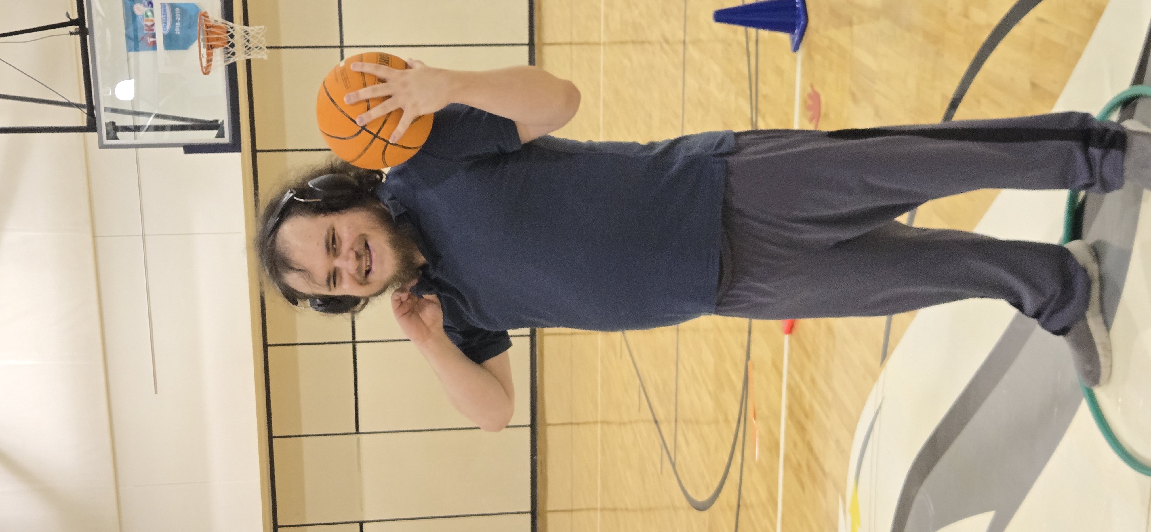 Student holding a basketball